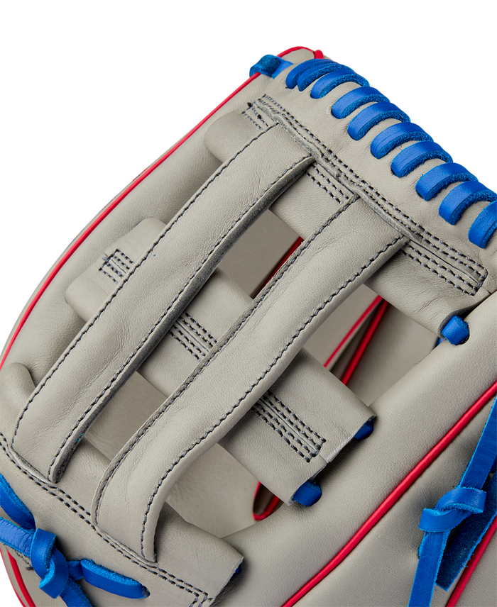 Close-up of the Wilson A900 PF12 12" Baseball Glove (WBW10257112), a light gray youth glove with blue laces, red trim, and detailed stitching—perfect Pedroia Fit utility glove for young players.