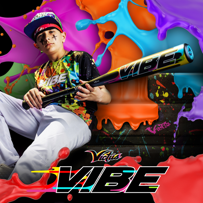 A young baseball player in a vibrant uniform confidently holds the 2024 Victus Vibe (-8) USSSA bat (VSBVIB8), surrounded by splashes of color, with the word "VIBE" and the Victus logo boldly visible.