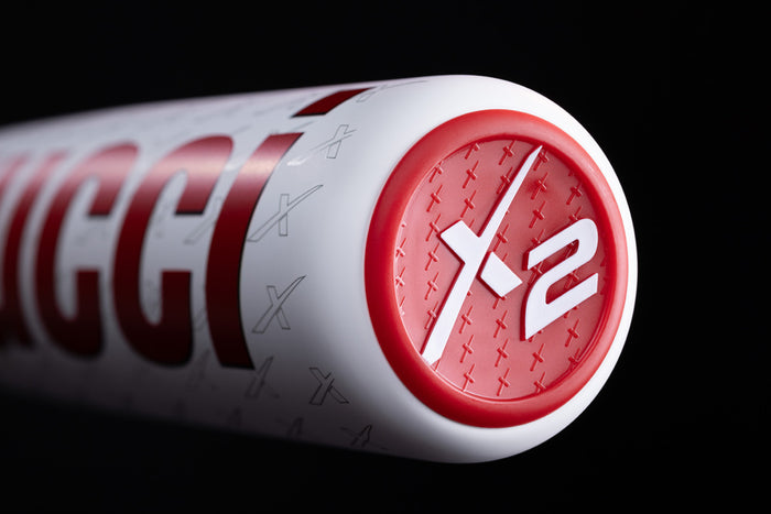 Close-up of the end cap on a 2025 Marucci CATX2 Connect (-10) 2 3/4" USSSA Baseball Bat (USED), showing X2 markings and an embossed red X pattern, highlighting Marucci’s advanced anti-vibration technology.