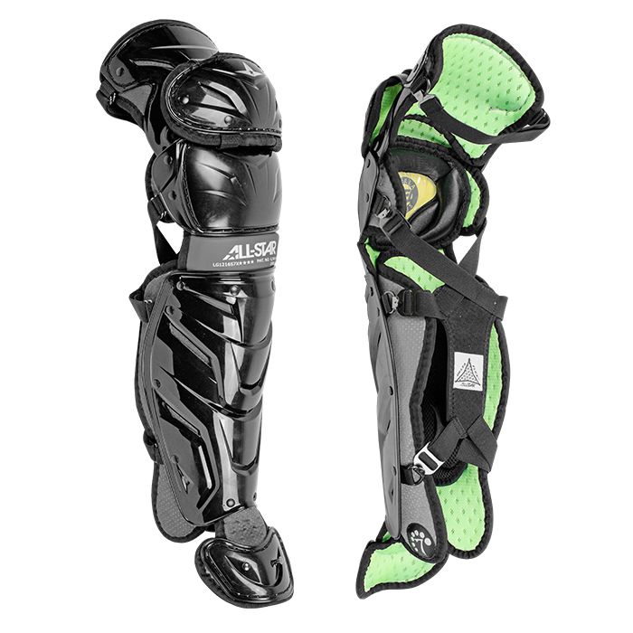 Two All Star System7 Axis Catcher's Leg Guards are shown—one displays the LINQ hinge system and hard shell, while the other reveals a padded, ventilated interior with adjustable straps.