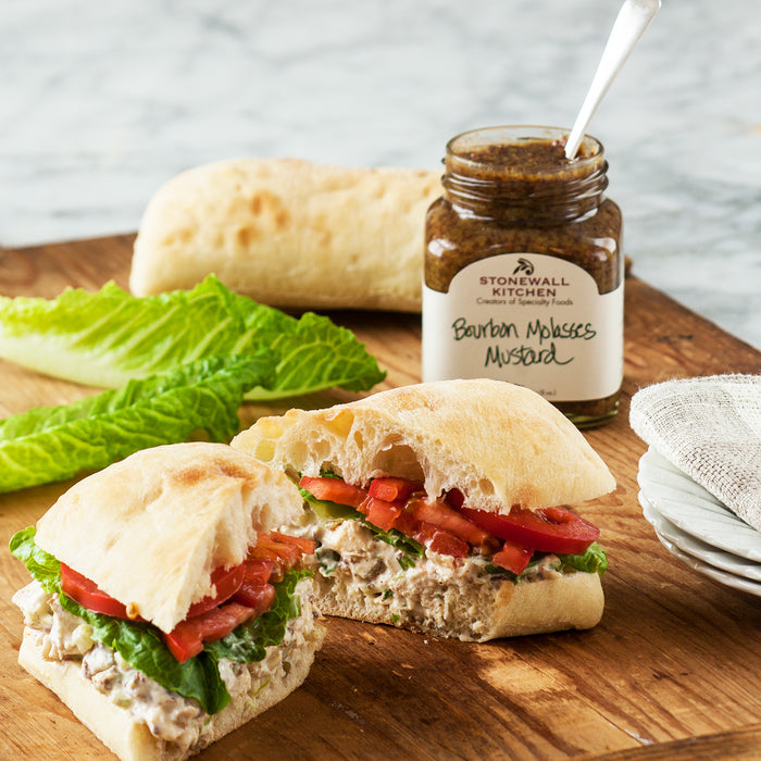 Chicken Salad Sandwich Salad On A Baguette With Lettuce, and Tomatoes Made With Stonewall Kitchen Bourbon Molasses Mustard