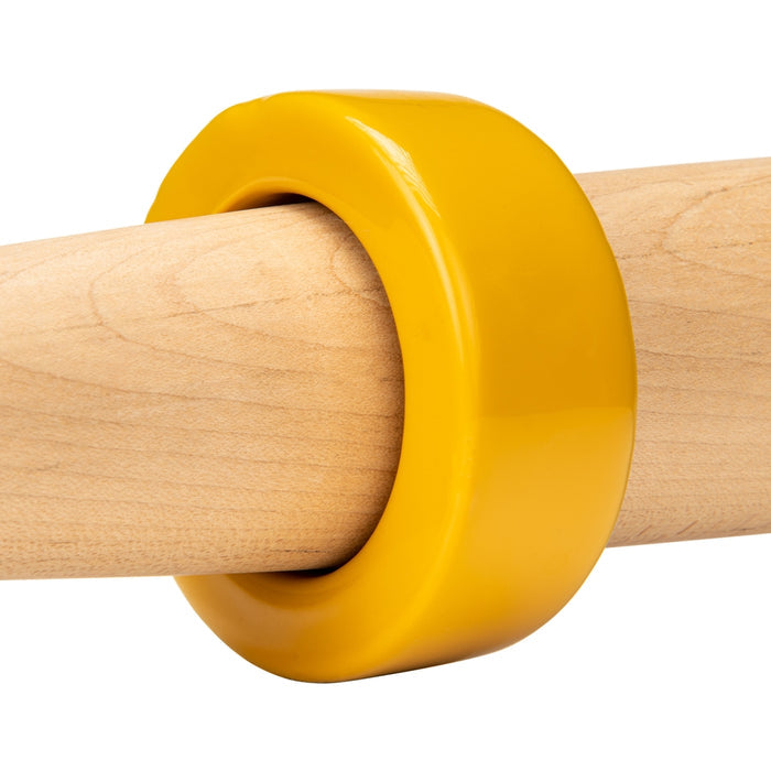 A Champro Sports Bat Weight (A014-A019) is fitted on a light wood training bat, shown against a white background, to help improve swing strength.