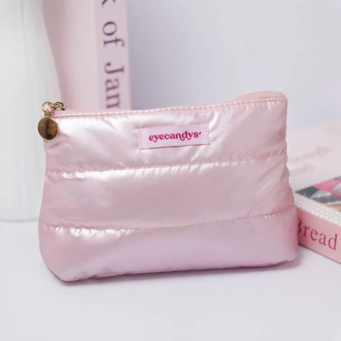 Soft pink EyeCandys cosmetic bag with zipper for organizing fragile items.