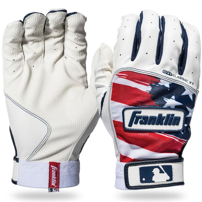 Two Franklin Classic XT Adult Batting Gloves: the left shows a white palm for superior grip, while the right features a red, white, and blue U.S. flag-inspired back with an MLB logo near the wrist. Ideal for adult hitters.