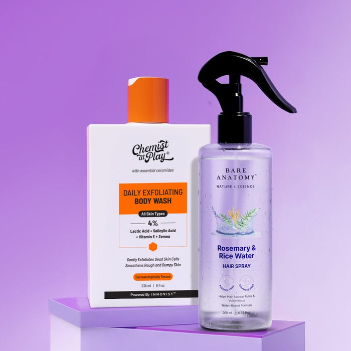 Two skincare products on a purple background, one labeled 'Daily Exfoliating Body Wash' and the other 'Rosemary & Rice Water Hair Spray'.
