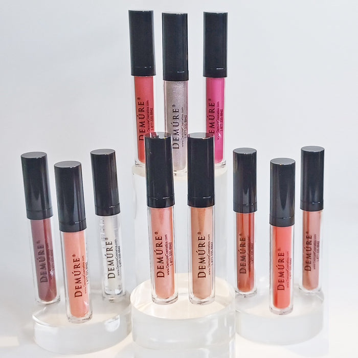 Group of Demure lip glosses on a white background