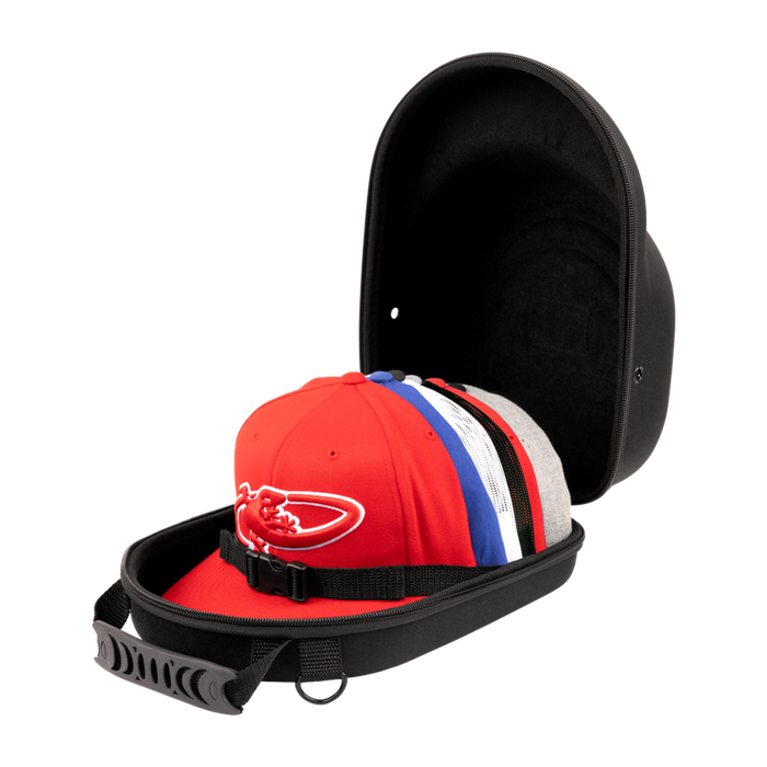 The Lizard Skins Hat Guardian: HATGD100 is a black, crush-proof hat case with a handle and interior strap, shown open to display several colorful baseball caps inside. The protective case is set against a plain background.