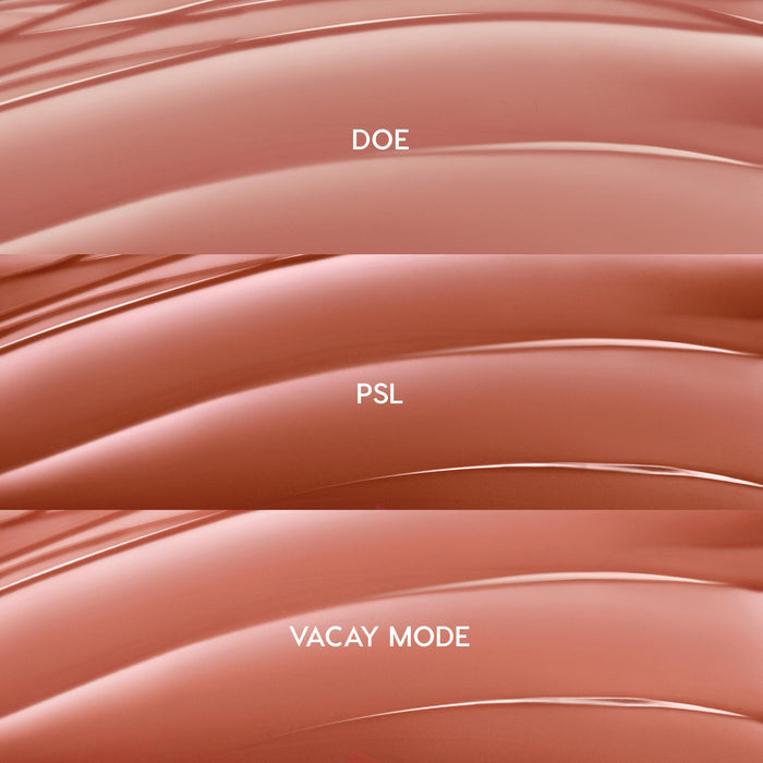 Glossy swatches showcase Lush Pout, ColourPop So Juicy Plumping Gloss Balm with Peptides: three nude-pink shades - Doe (rosy beige), PSL (warm caramel), and Vacay Mode (peachy nude) - layered in curved stripes on a clean backdrop.