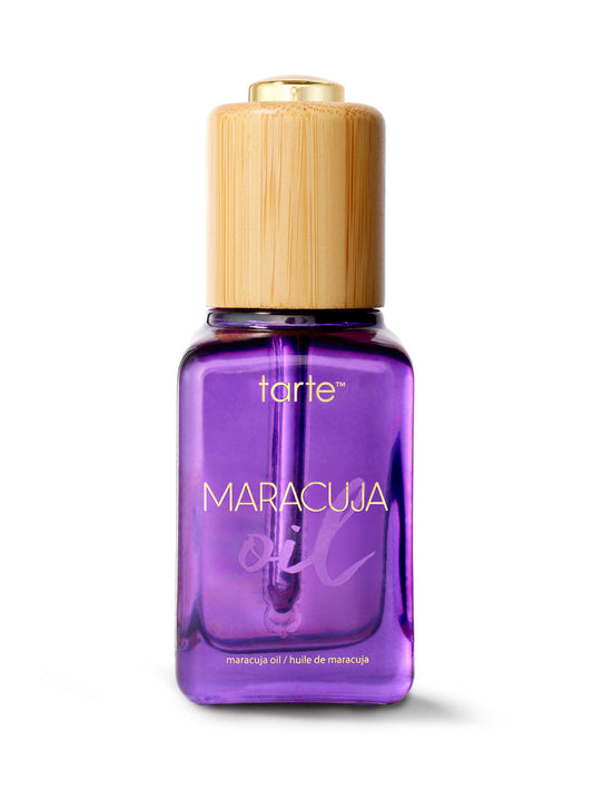 Tarte Maracuja oil bottle with wooden cap on a white background