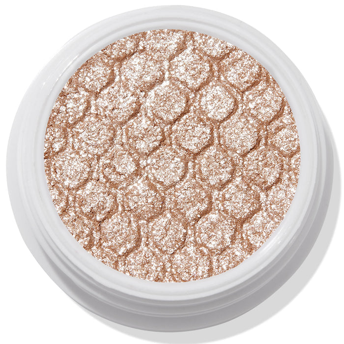 ColourPop Ritz Super Shock Shadow shimmering in a white round pot, its honeycomb-embossed, metallic champagne-beige glitter cream-to-powder formula catching light in a close-up product shot on a clean background.