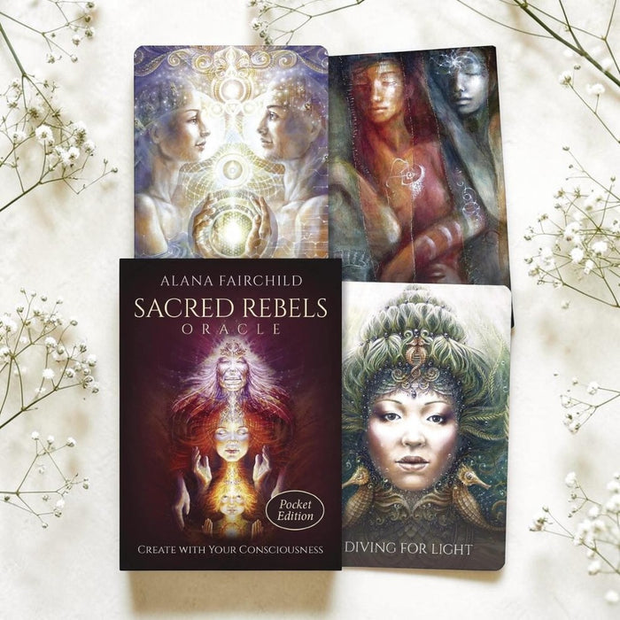 Sacred Rebels Oracle cards by Alana Fairchild on a light background with flowers.