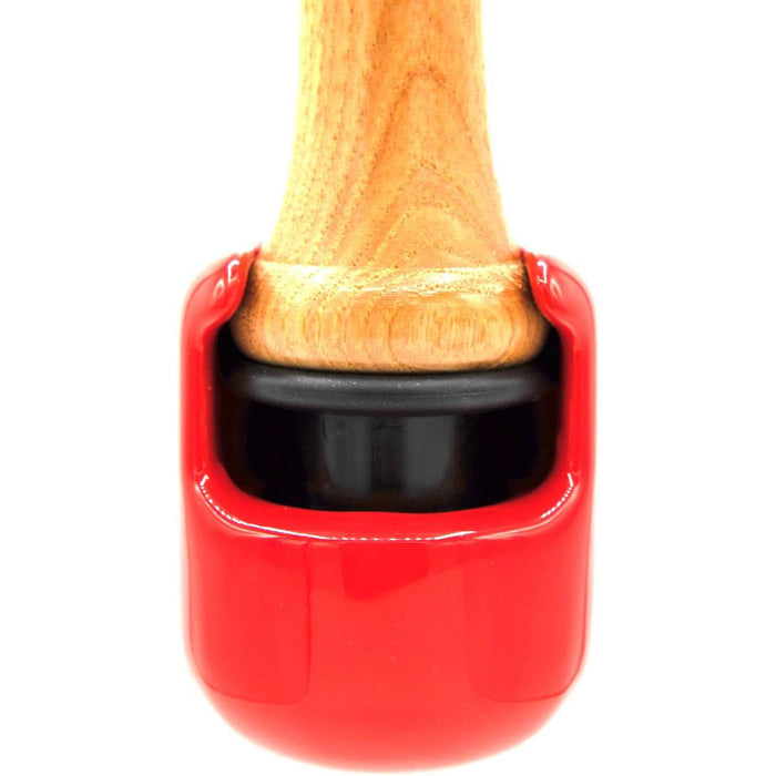 A close-up of The Hitting Knob Bat Weight by Hitting Knob, a red baseball hitting aid designed to boost bat speed and serve as a dependable knob for training.